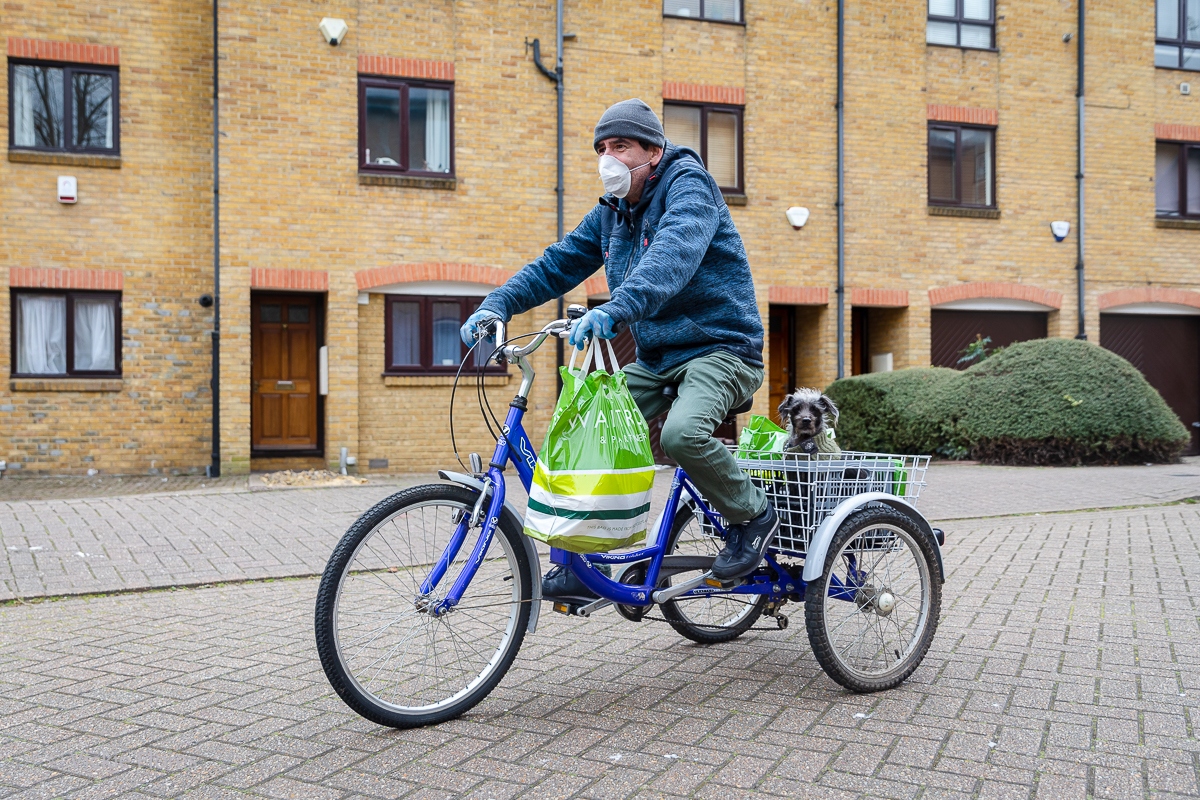 Local resident John and his dog Millie delivering shopping for vulnerable residents