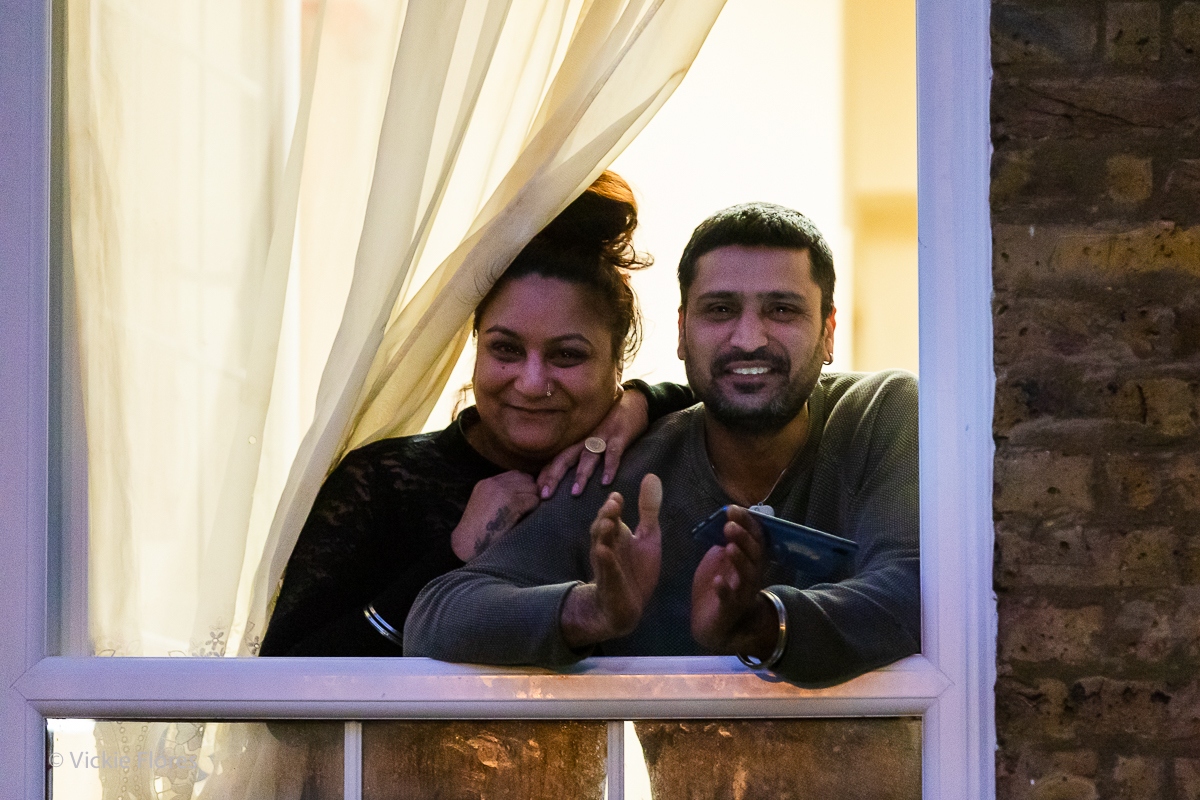 Wapping residents clap from their window on the Greenbank Estate on a Thursday evening