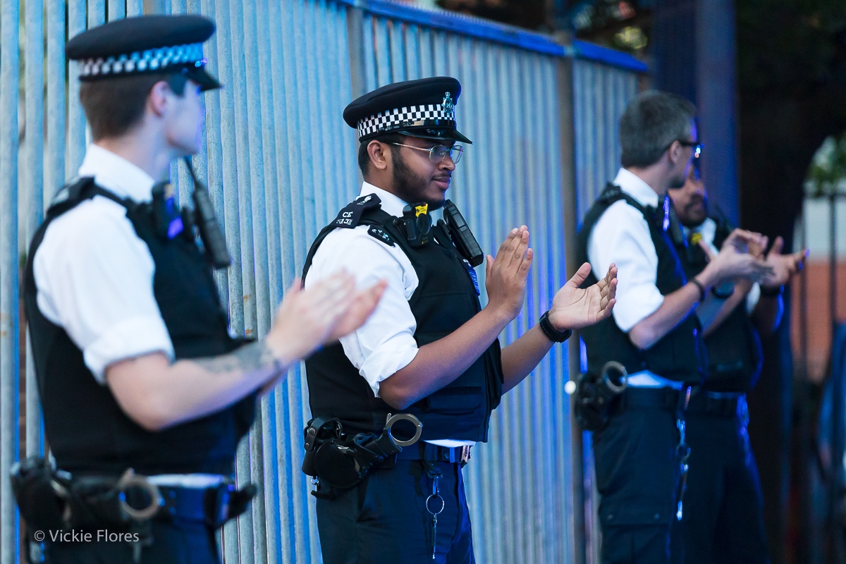 Police officers clap for carers outside the Royal London Hospital